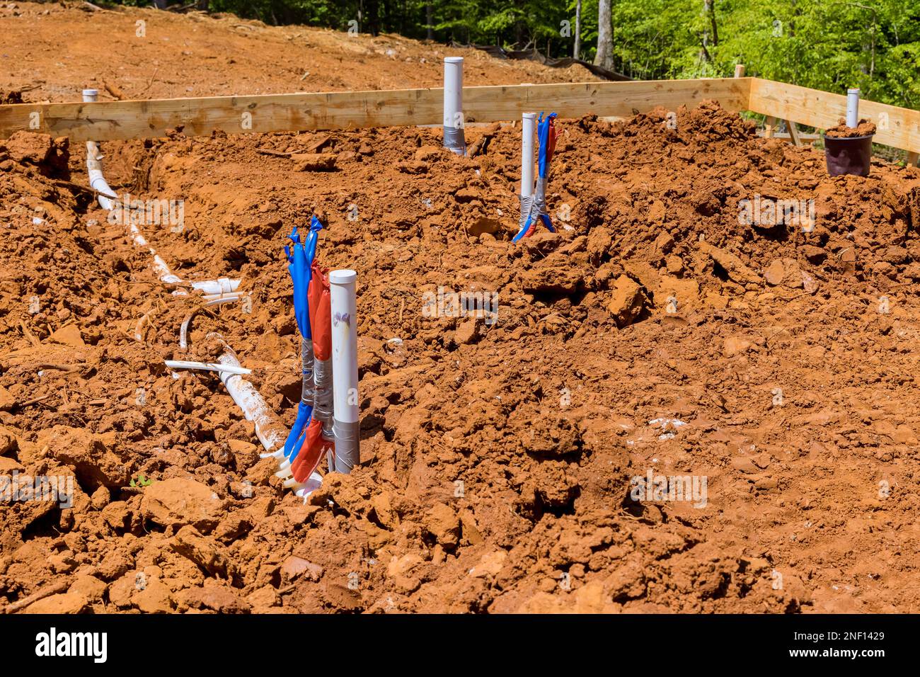 Installing in ground under foundation of new home, laying utilities