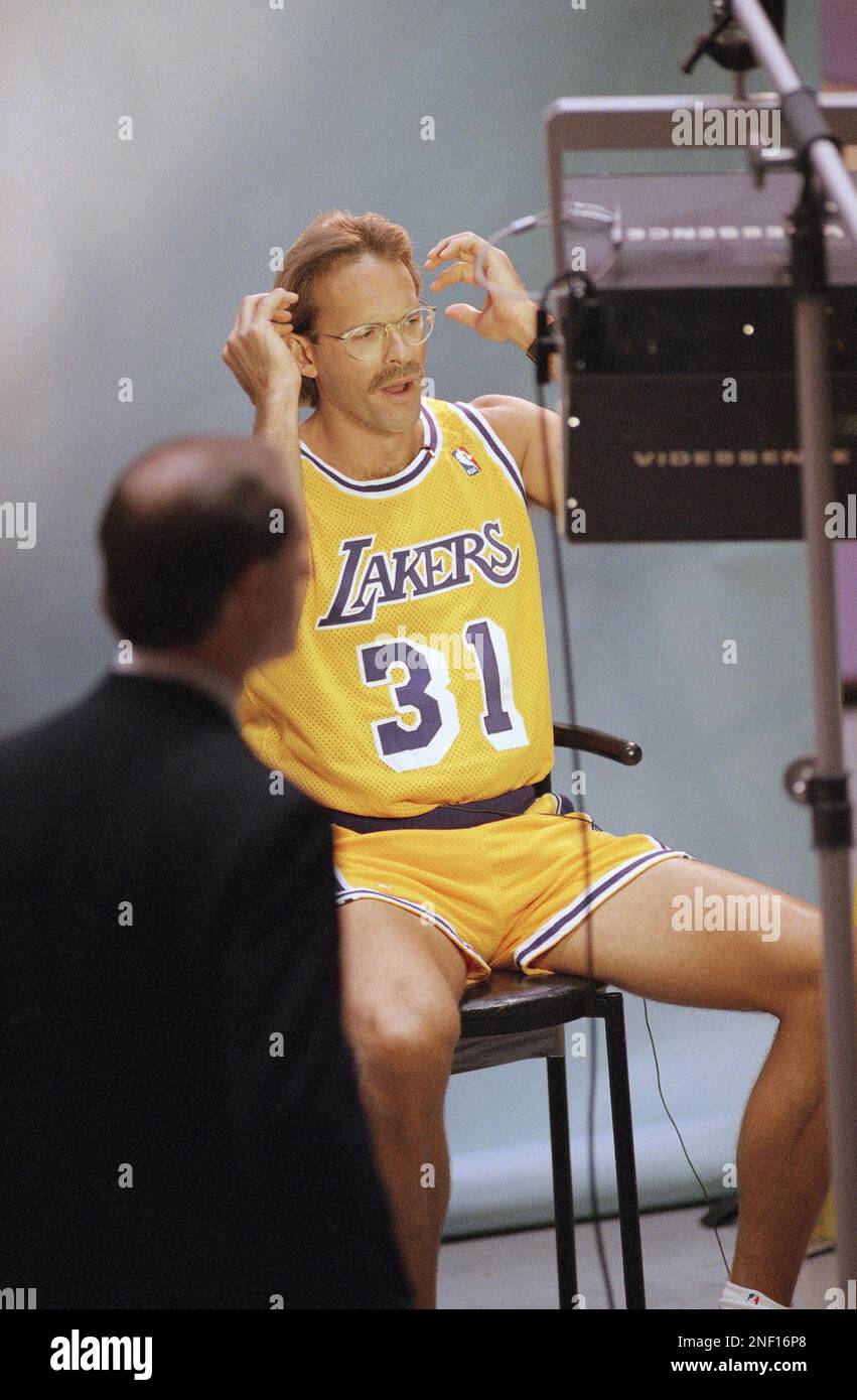 Los Angeles Lakers Kurt Rambis primps for the television camera before an interview at the team s media day held on Monday Oct. 16 1995 at the Forum in Inglewood California. AP Photo Nick