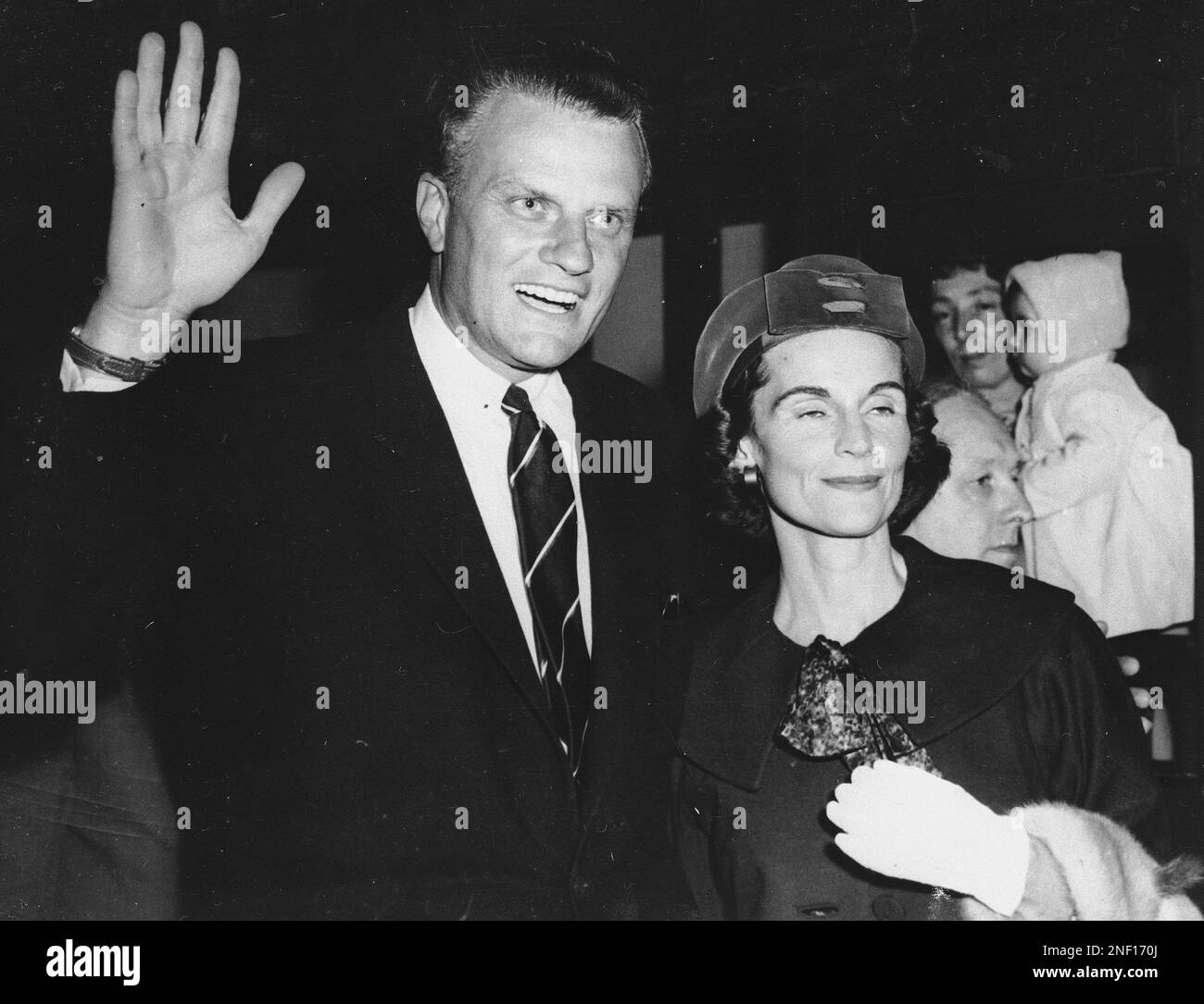 Evangelist Billy Graham, shown with his wife, Ruth on arrival in London ...