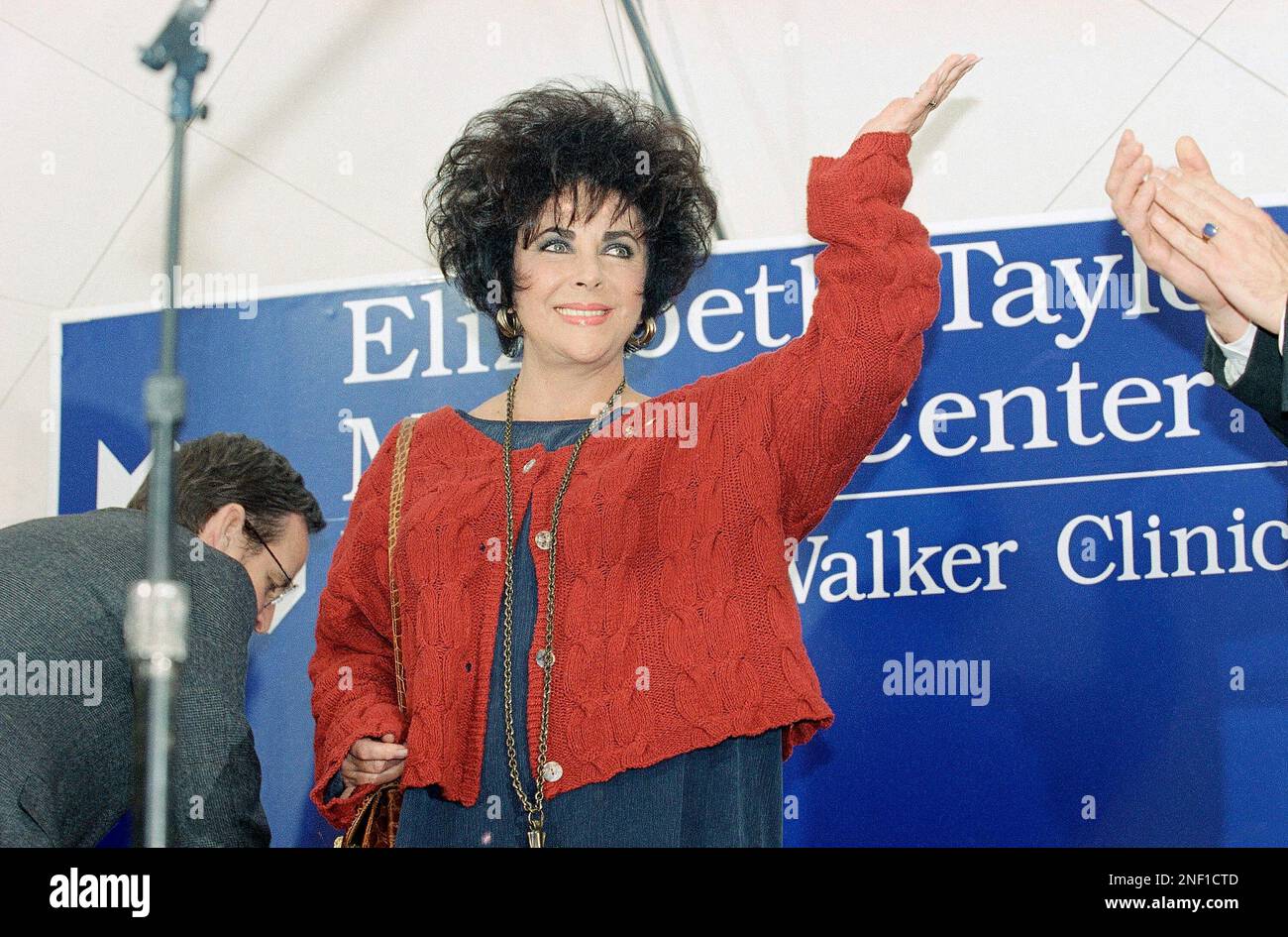 Actress Elizabeth Taylor gestures during the dedication ceremony for