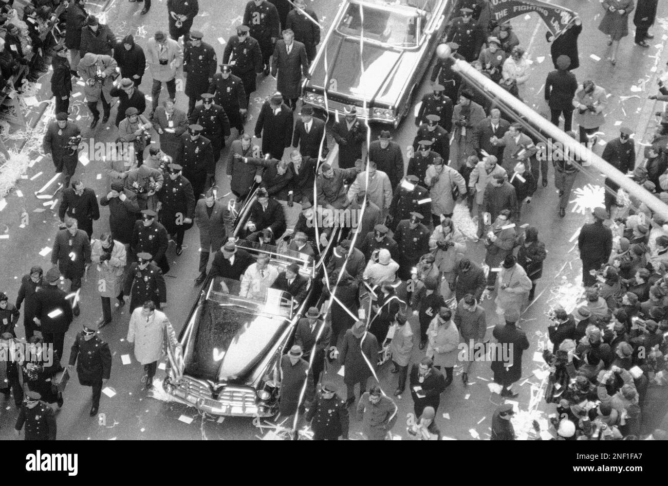 Crowd mobs the Apollo 8 astronauts as they parade up Broadway in an open car, Jan. 10, 1969 in New York. From left are Capt. James A. Lovell Jr., Col. Frank Borman and Lt. Col. William A. Anders. (AP Photo) Stock Photo