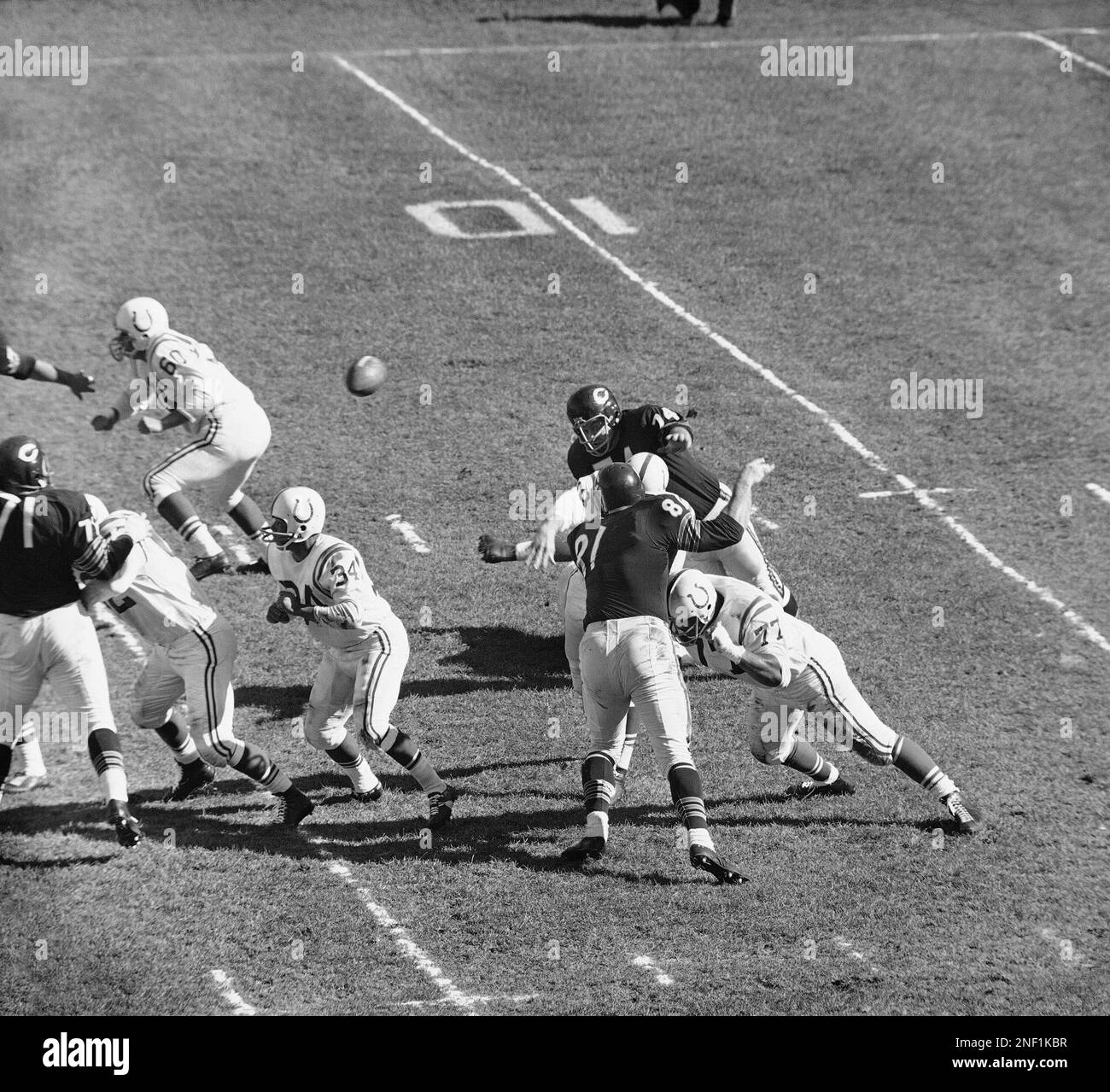 Baltimore Colts quarterback Johnny Unitas (19) cuts loose for a