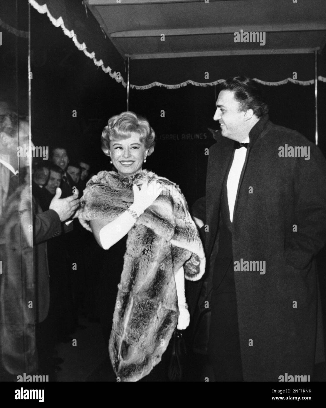 Italian movie director Federico Fellini and his wife, film star Giulietta  Masina, arrive at a fashionable Rome movie theatre on Feb. 3, 1960 for the  premiere of a new Italian picture, “La