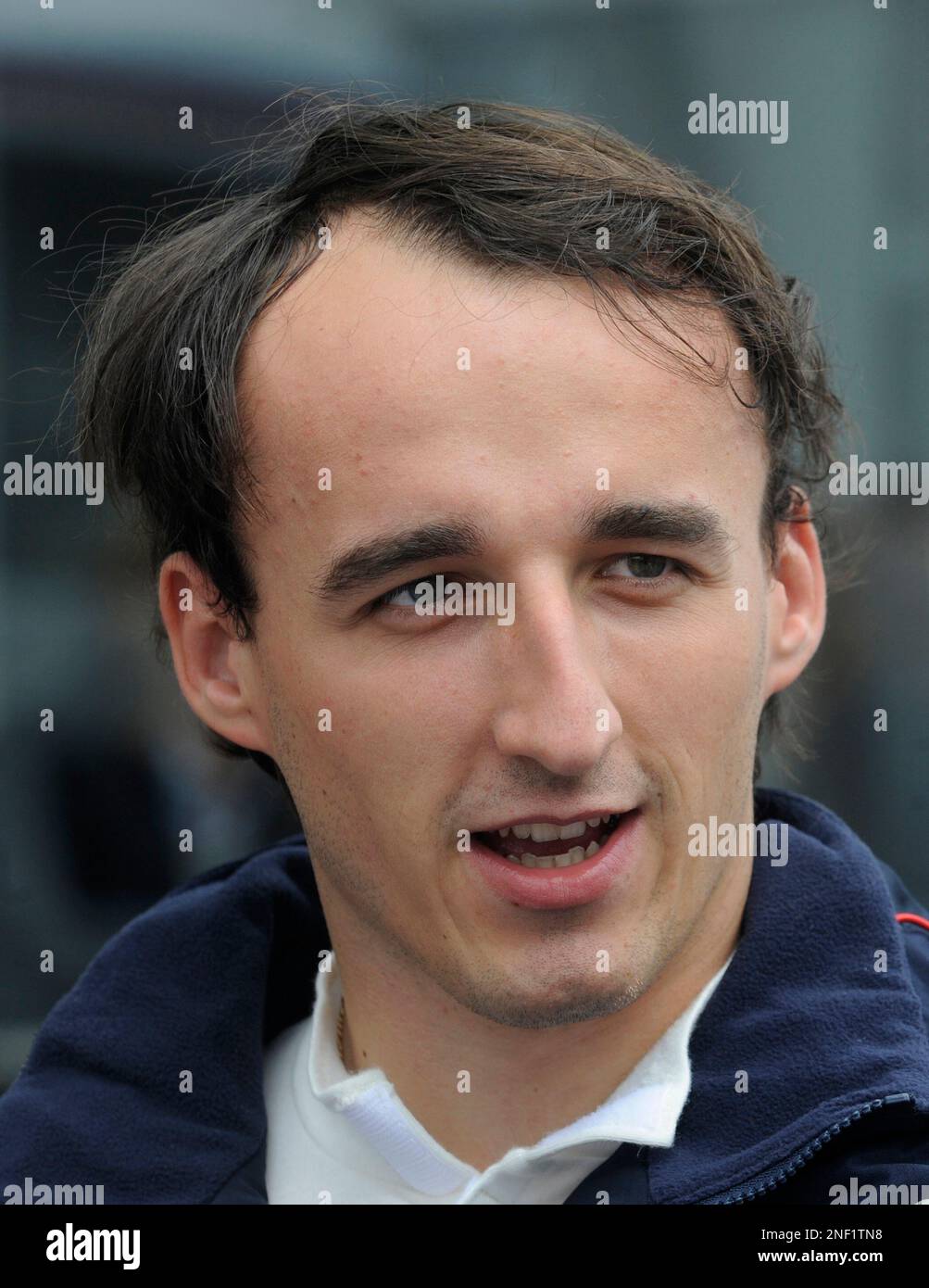 BMW Sauber driver Robert Kubica of Poland stands in the paddock before