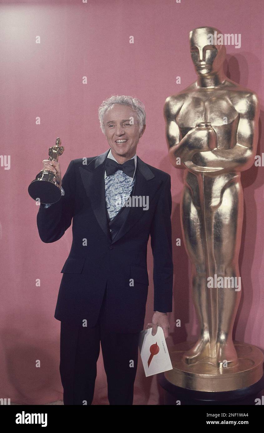 Haskell Wexler, cinematographer holding Oscar he won for “Best in Cinematography” for movie