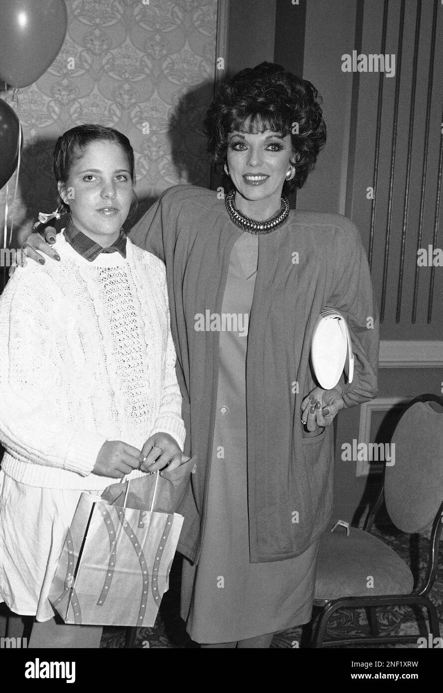 Actress Joan Collins, right, pauses with her daughter Katy during the