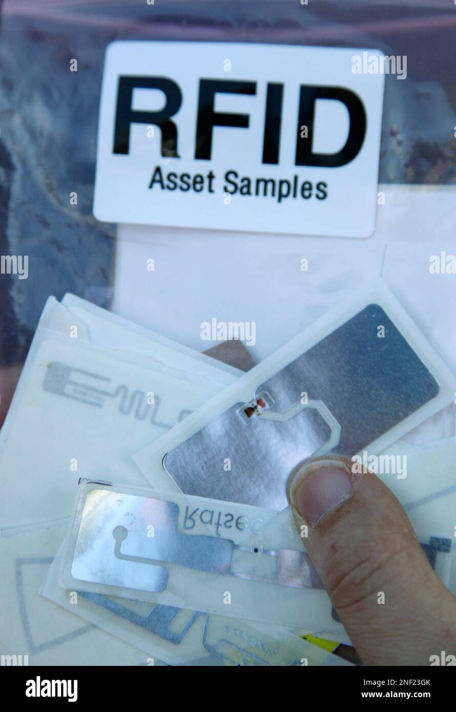 Chris Paget, the "ethical hacker," holds examples of RFID (radio