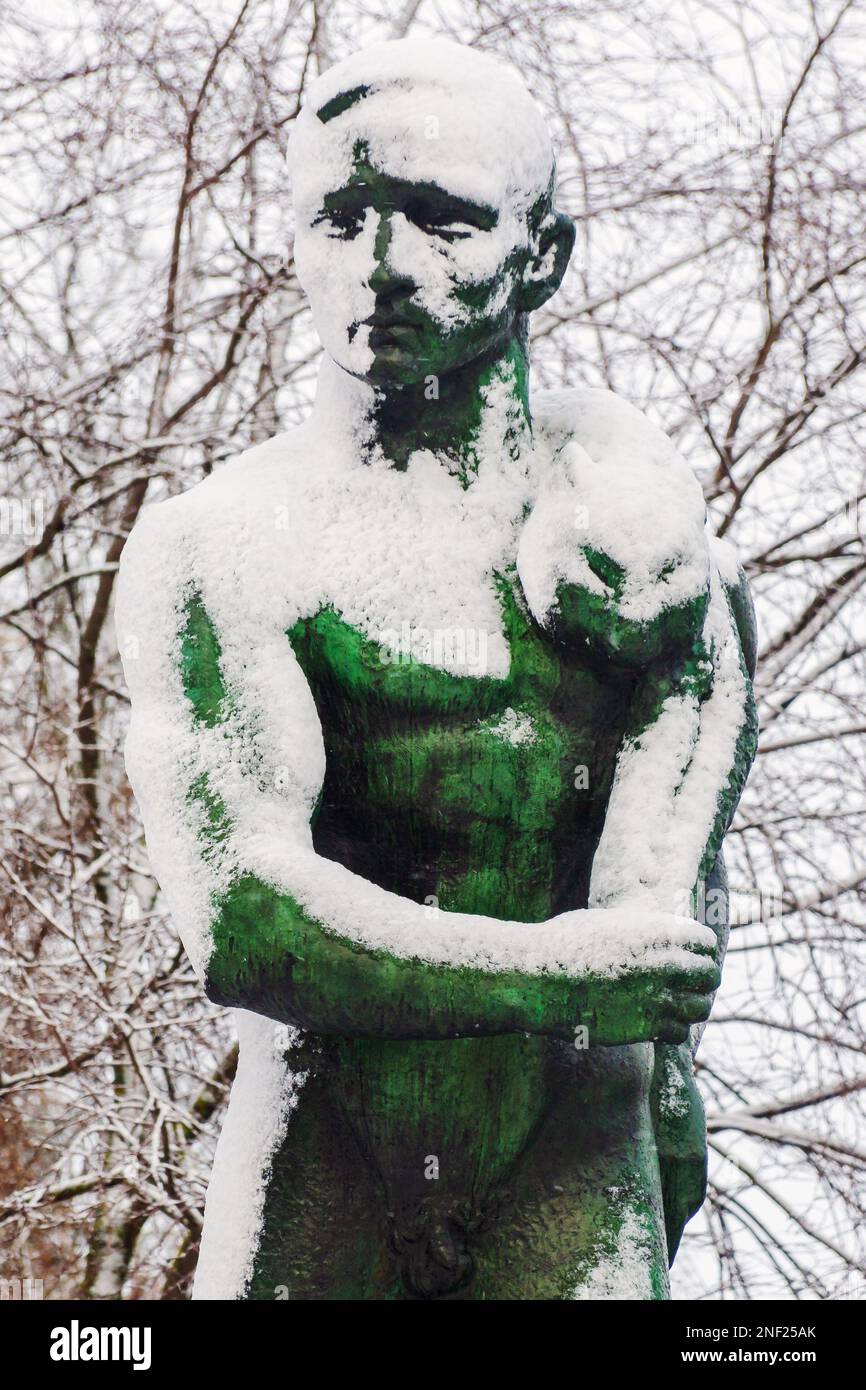 Snowy and frosty male figure bronze statue by sculptor Väinö Aaltonen by Hämeensilta bridge in Tampere Finland Stock Photo