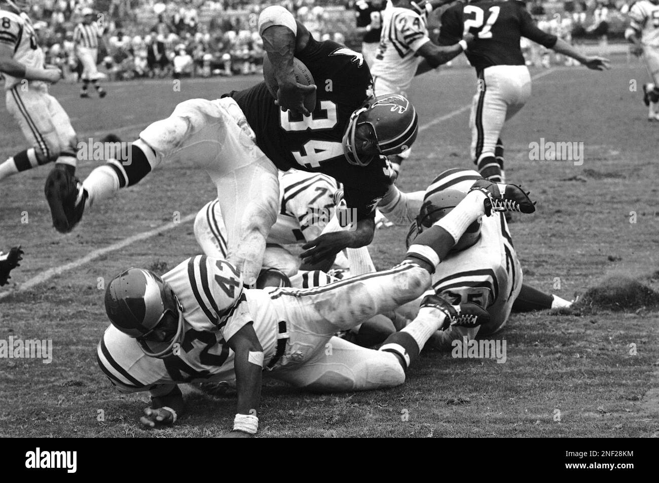 Atlanta Falcons running back Junior Coffey can go no farther. He is stopped  after a short gain by Billy Ray Smith (left), Dennis Gaubatz (53) and Fred  Miller (76) of the Baltimore