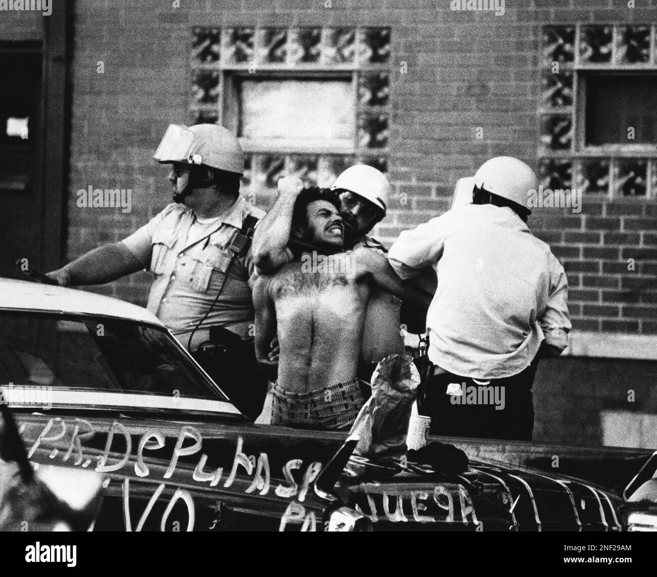 Chicago policemen subdue demonstrator in Chicago’s Humboldt Park on ...