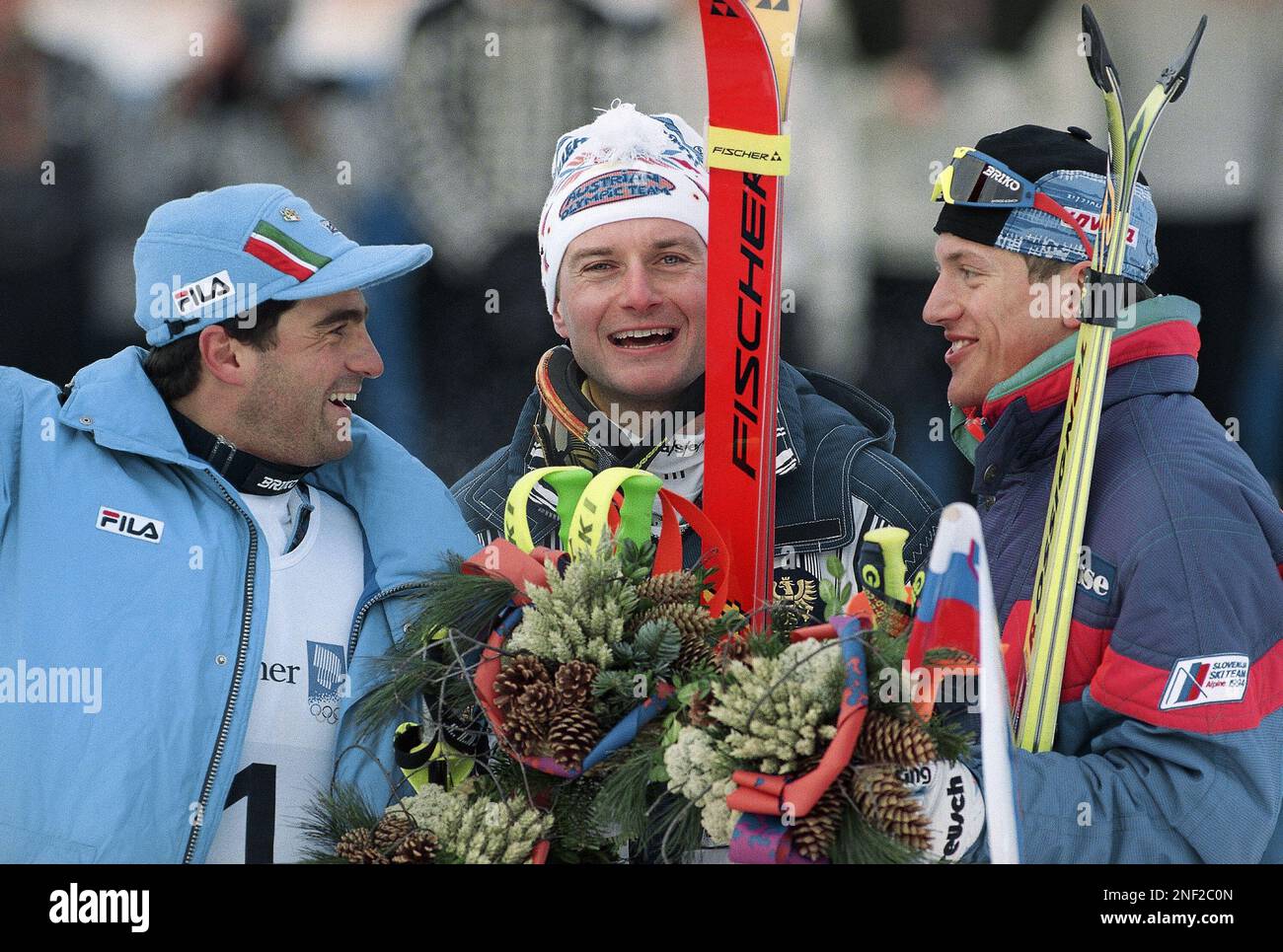 Gold medalist Thomas Stangassinger of Austria, center, beams as he is ...