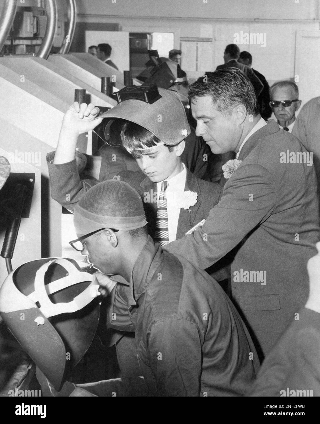 The head of the nation’s "War on Poverty," Sargent Shriver, and his 13