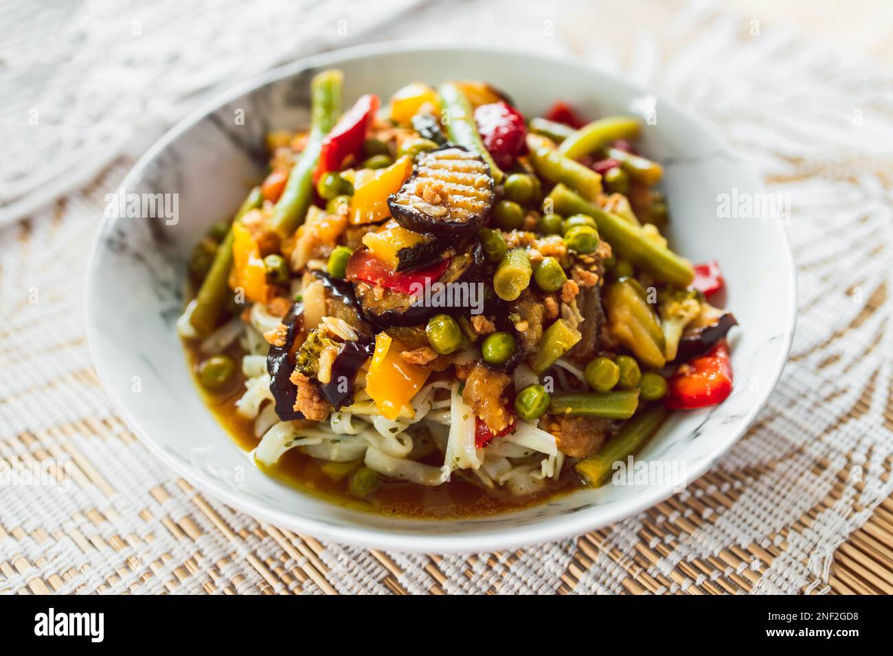 plant-based rice noodles topped with mixed vegetables, healthy vegan food recipes Stock Photo