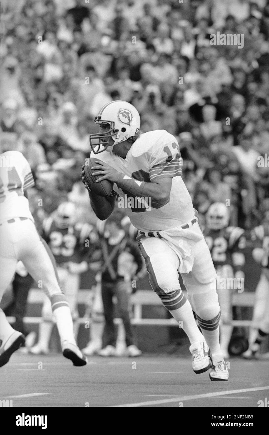Miami Dolphins quarterback Dan Marino looks downfield for an open