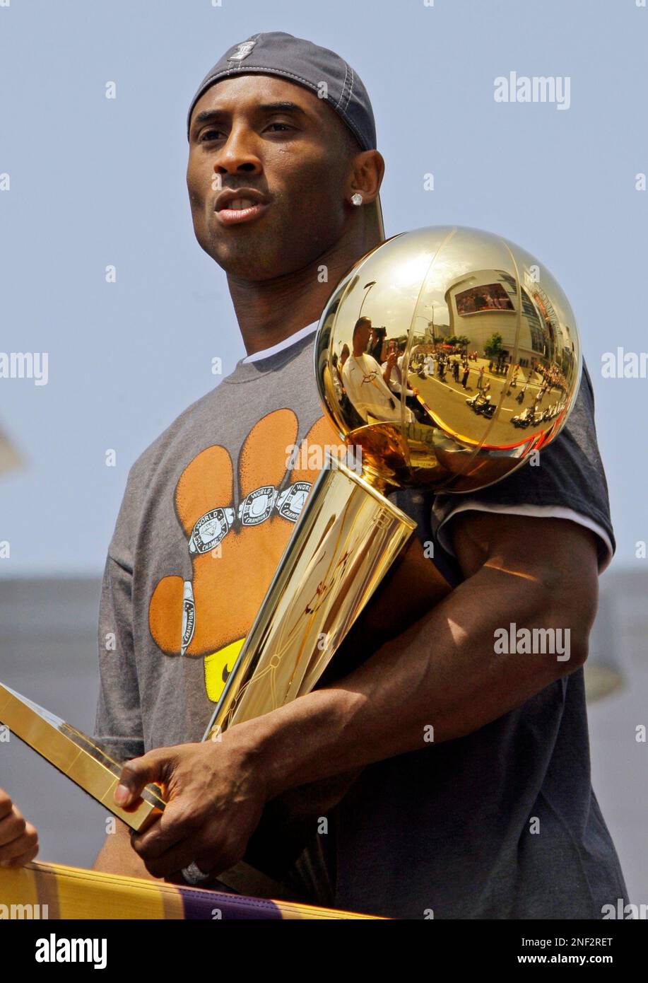 kobe holding trophy