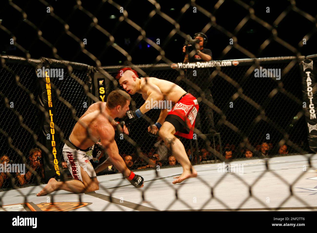Dan Hardy, right, of England, fights U.S. Marcus Davis, of Bangor, Maine, during their Ultimate Fighting Championship bout in Cologne, Germany, on Saturday, June 13, 2009. The Ultimate Fighting Championship UFC is the world leading professional mixed martial arts MMA organization. **Eds Note: German spelling of Cologne is Koeln** (AP Photo/Hermann J. Knippertz) Stock Photo