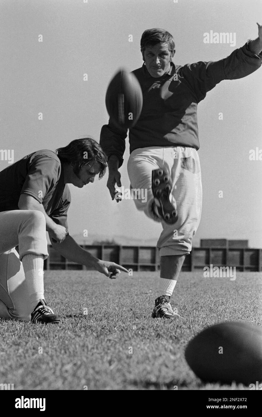 With Ken Stabler holding, veteran quarterback George Blanda of the Oakland  Raiders, practices his kicking, Nov. 3, 1971. He booted a field goal  against the Kansas City Chiefs to become the all-time