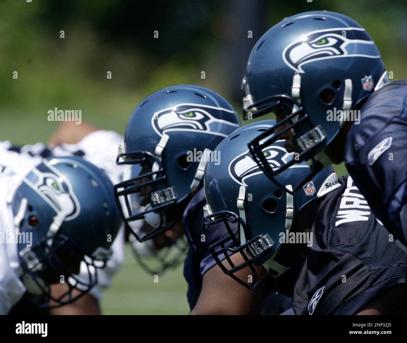 Seattle Seahawks football helmets are shown during practice drills