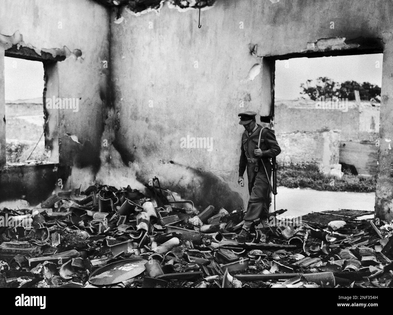British Officers Inspect The Charred Remains Of Yannis Akritas s Coffee british-officers-inspect-the-charred-remains-of-yannis-akritas-s-coffee