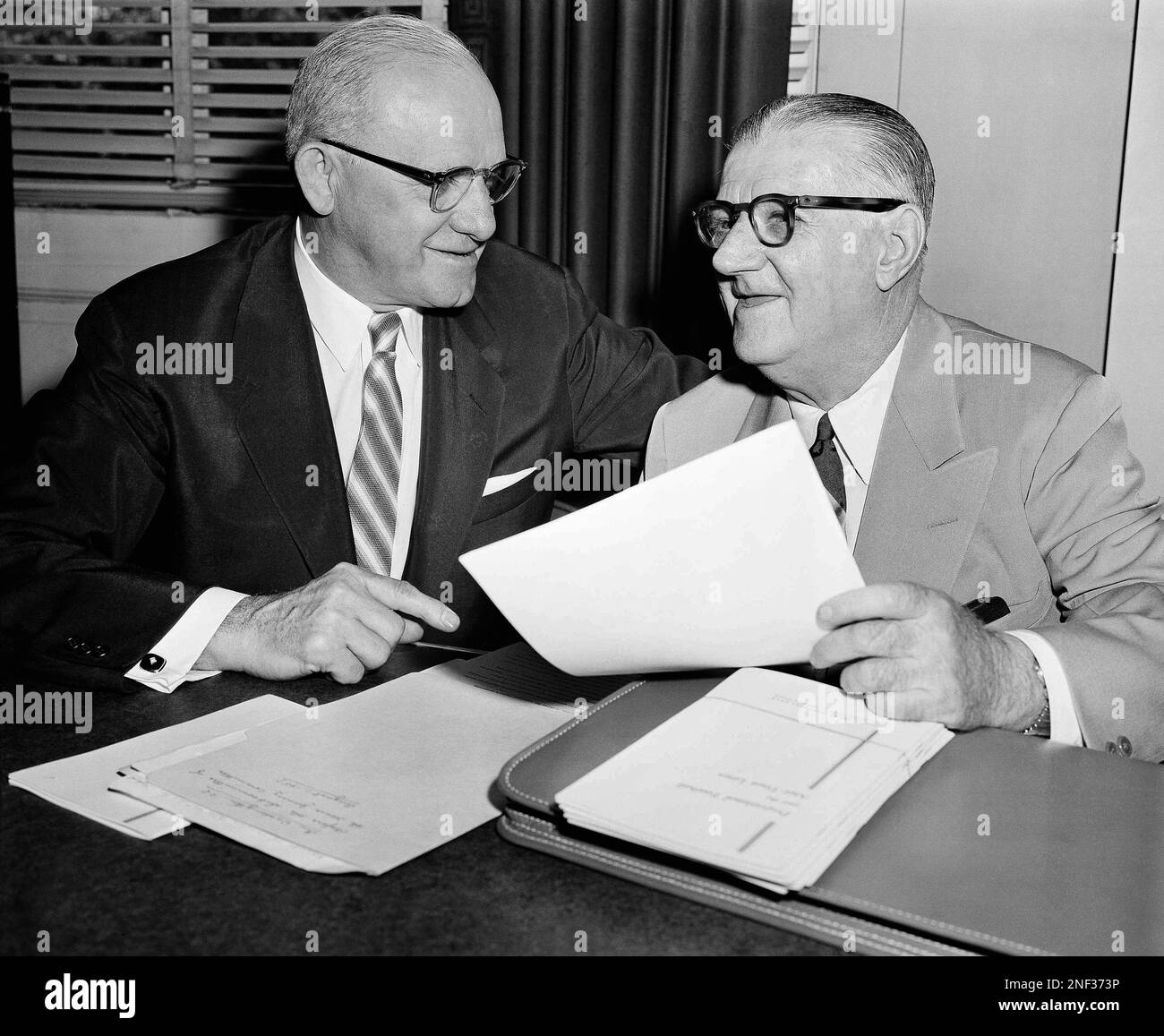 Commissioner Bert Bell of the NFL chats with George Halas, left, president  of the Chicago Bears, after Bell told the House Antitrust Subcommittee that  he now officially recognizes the league's Players Association