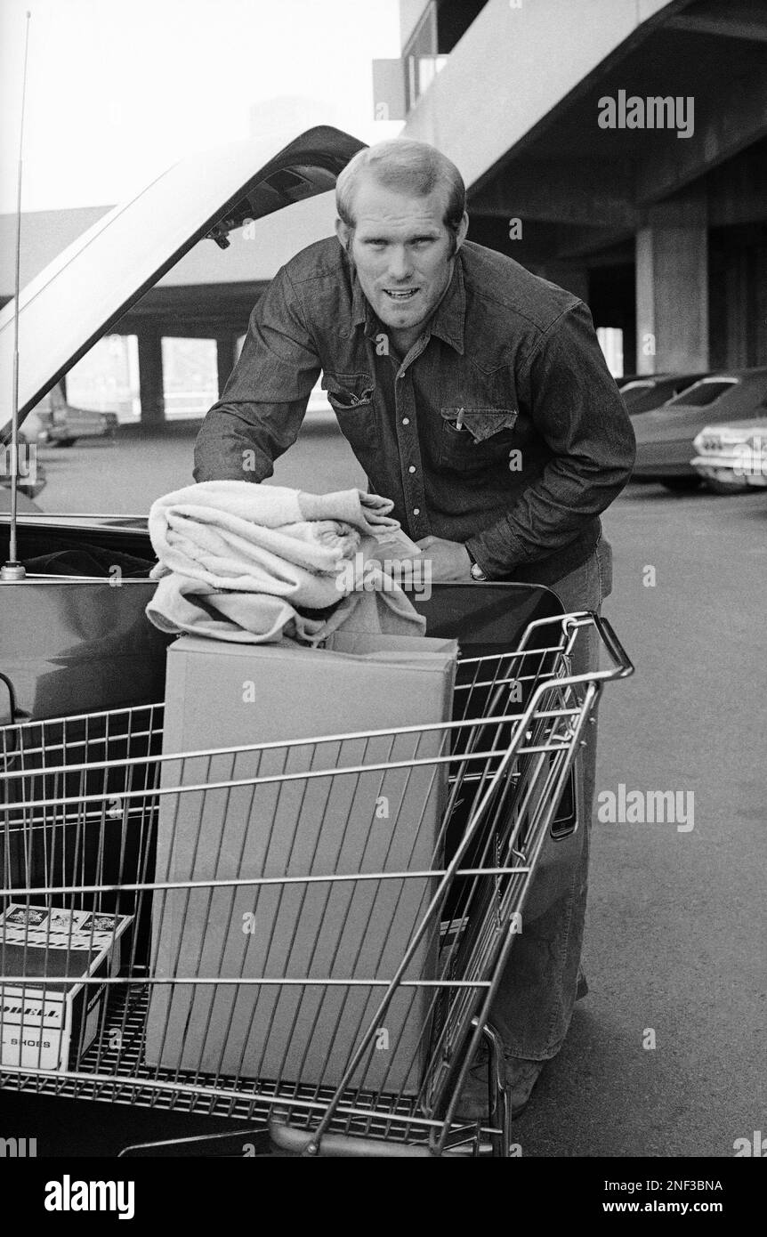 Steelers quarterback Terry Bradshaw, using a grocery shopping cart