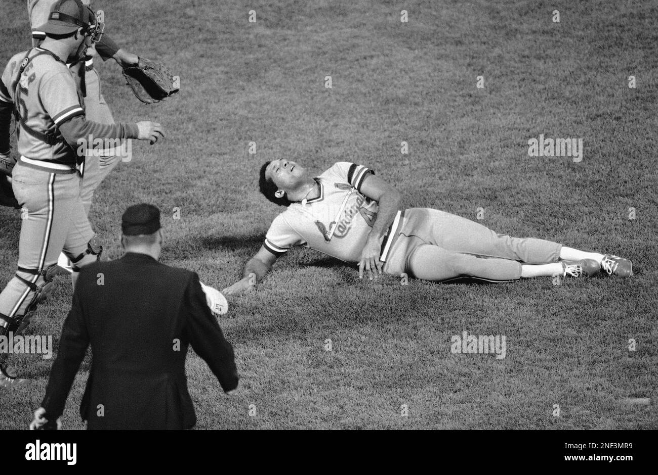 Joaquin Andujar of the St. Louis Cardinals is carried off the