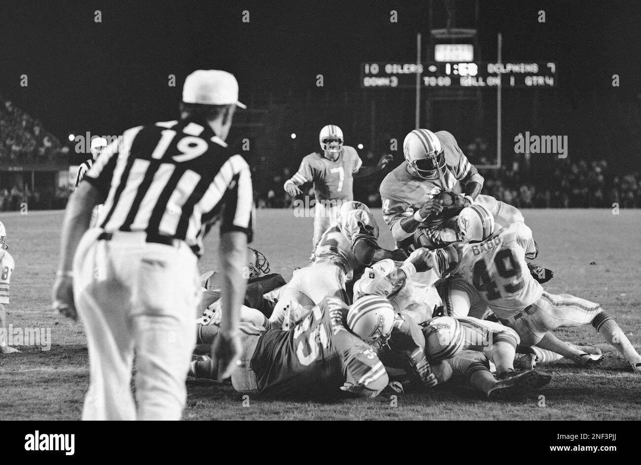 Houston Oiler quarterback Dan Pastorini (7) is sacked from the blind side  by Washington Redskin defensive tackle Diron Talbert (72) in the second  quarter of the game, Sunday, Oct. 19, 1975, Houston