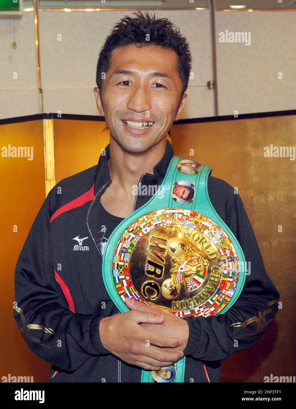 WBC flyweight champion Daisuke Naito of Japan smiles with his belt
