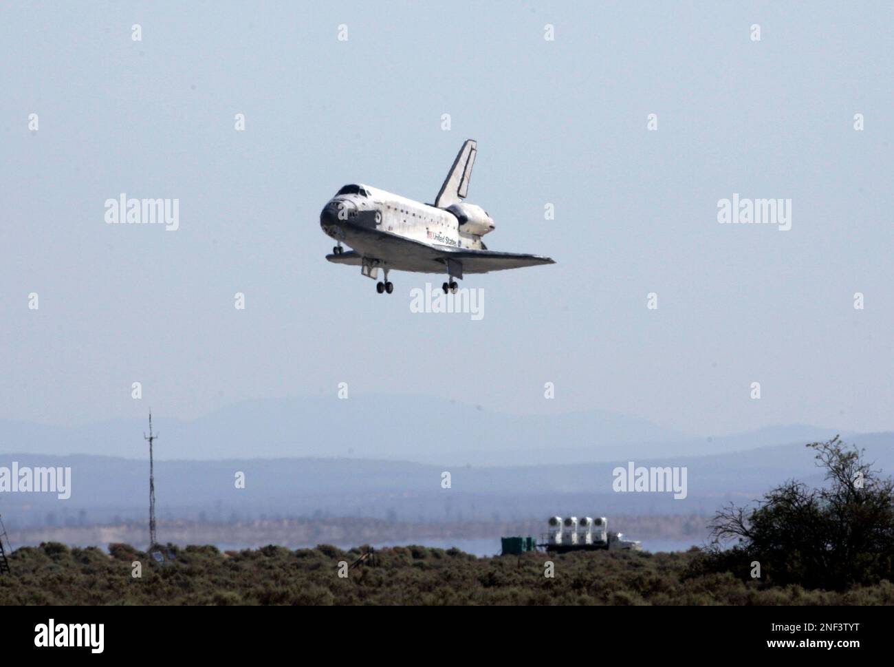 The space shuttle Atlantis glides in for a landing at the NASA Dryden ...