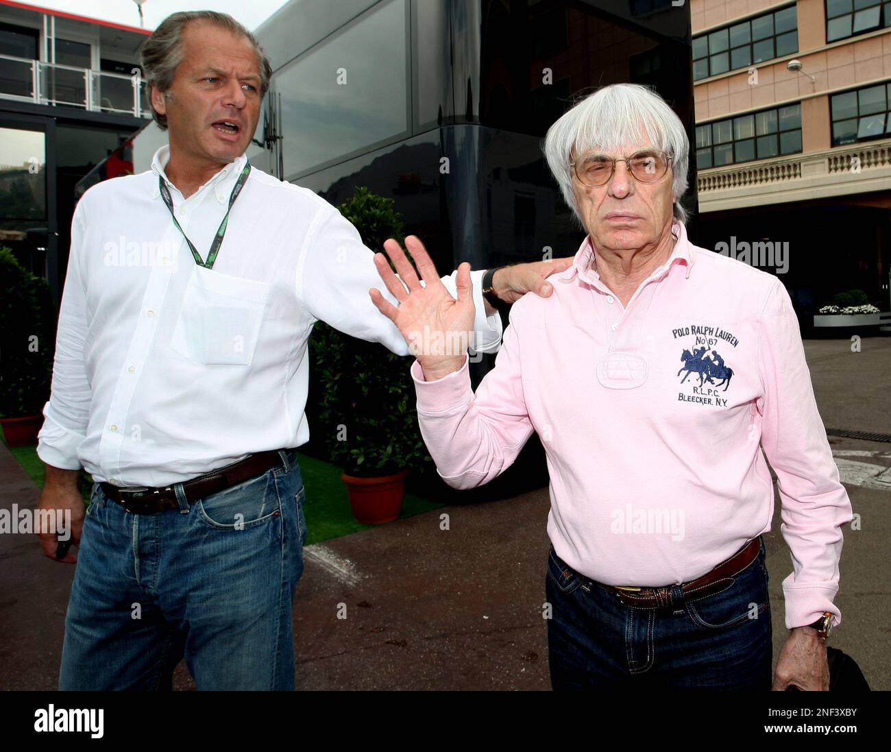 Bernie Ecclestone, president and CEO of the Formula One management , right, and his assistant Martin Reiss arrive to attend a FOTA (Formula One Teams Association) meeting at the Monaco racetrack, Friday, May 22, 2009. (AP Photo/Claude Paris) Stock Photo