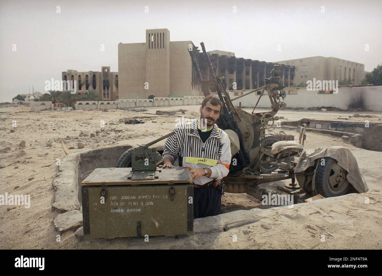 A Kuwaiti resistance person poses on Wednesday, Feb. 27, 1991 in Kuwait