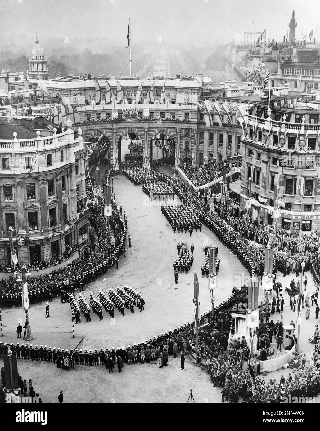 British troops are shown passing through Admiralty Arch during the ...