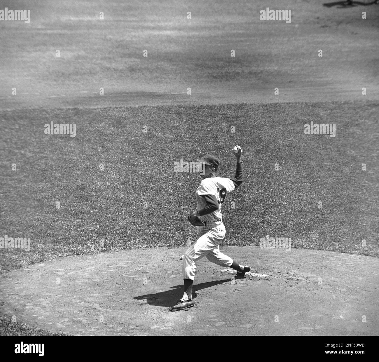 New York Mets Pitcher Jay Hook is shown in action at New York's Polo