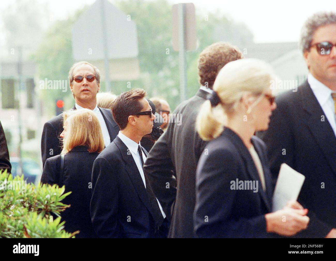 Chevy Chase attends the funeral of John Candy at St. Martin of Tours  Catholic Church in Los Angeles, March 9, 1994. Chase starred with John Candy  in the film "National Lampoon's Vacation." (