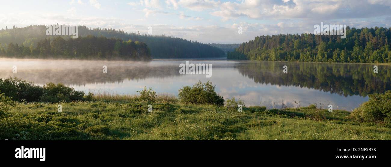 Panorama of the early June morning on Ladoga lake. Karelia, Russia Stock Photo