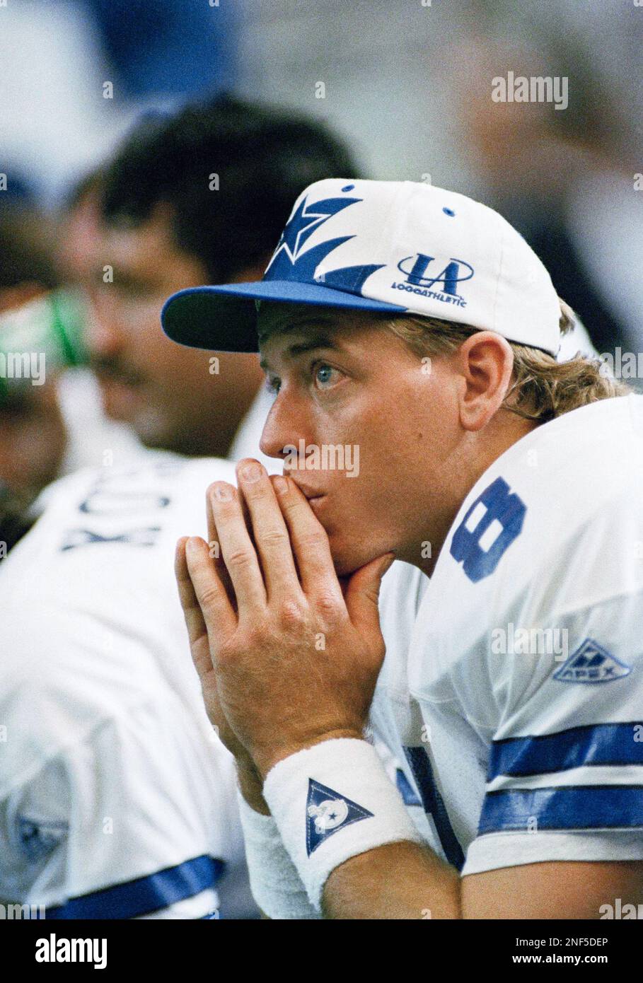 Dallas Cowboys quarterback Troy Aikman watches from the bench as