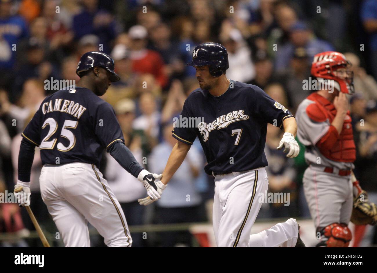 Milwaukee Brewers' J.J. Hardy (7) is congratulated by Milwaukee Brewers' Ryan  Braun after hitting a home run during the seventh inning of a baseball game  Sunday, June 3, 2007, in Milwaukee. (AP