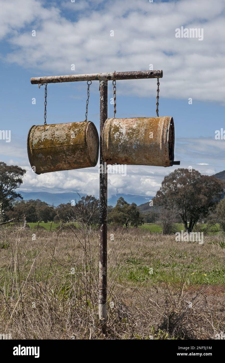 Milk pails form an improvised mailbox at a farm in the Upper Murray region of Victoria, Australia Stock Photo