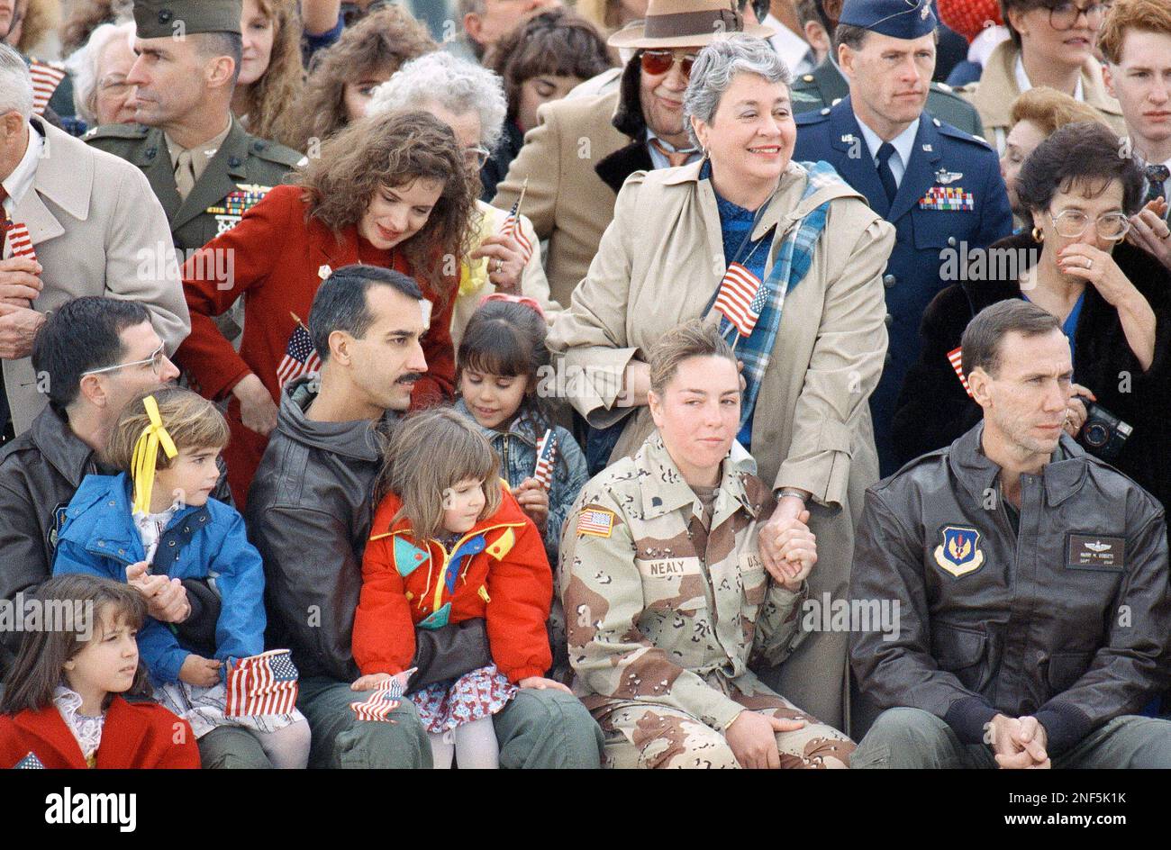 Army Spc. Melissa Rathbun-Nealy, of Newaygo, Mich., holds the hand of ...