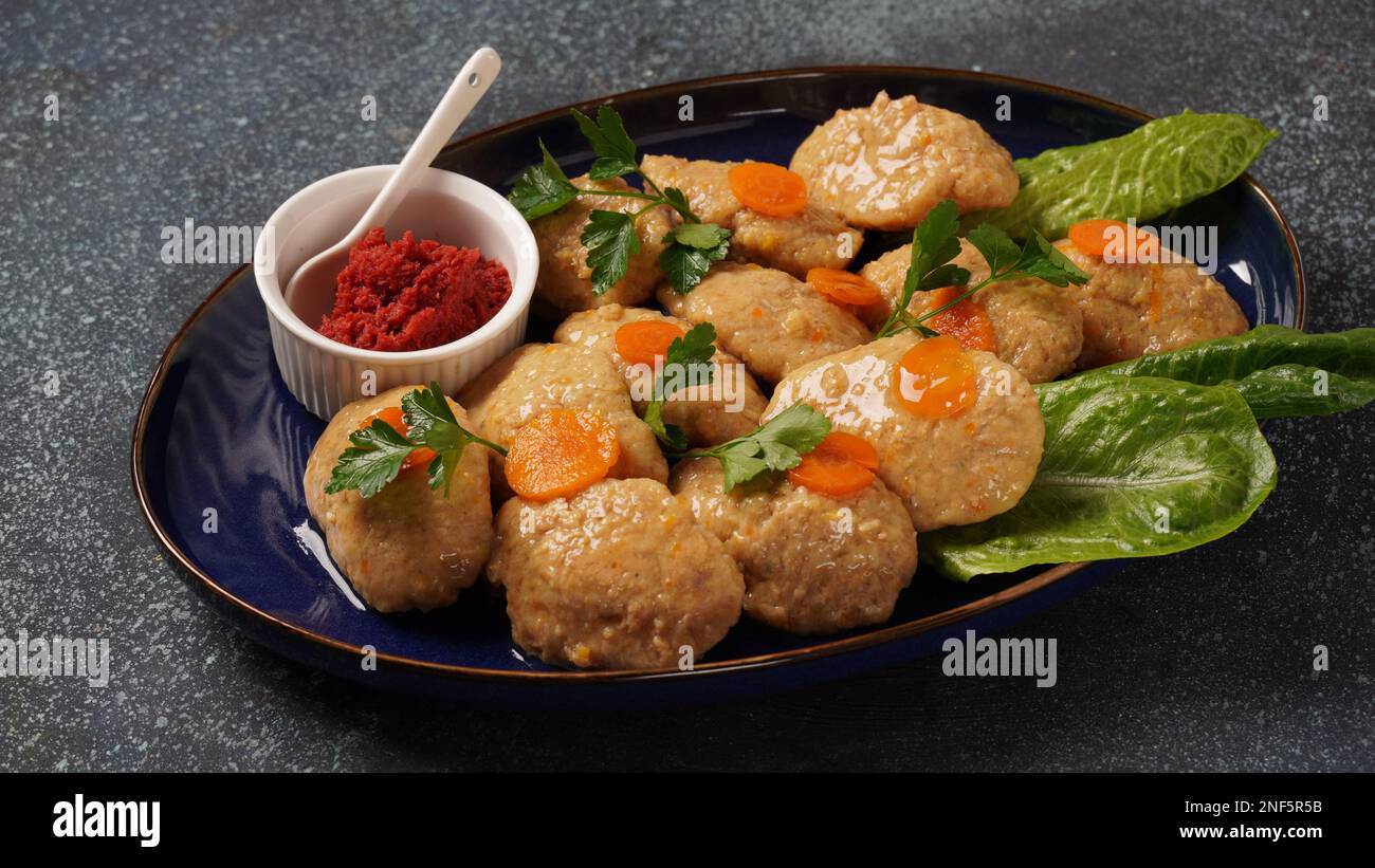 Gefilte fish with carrots, lettuce, horse radish. Passover traditional ...