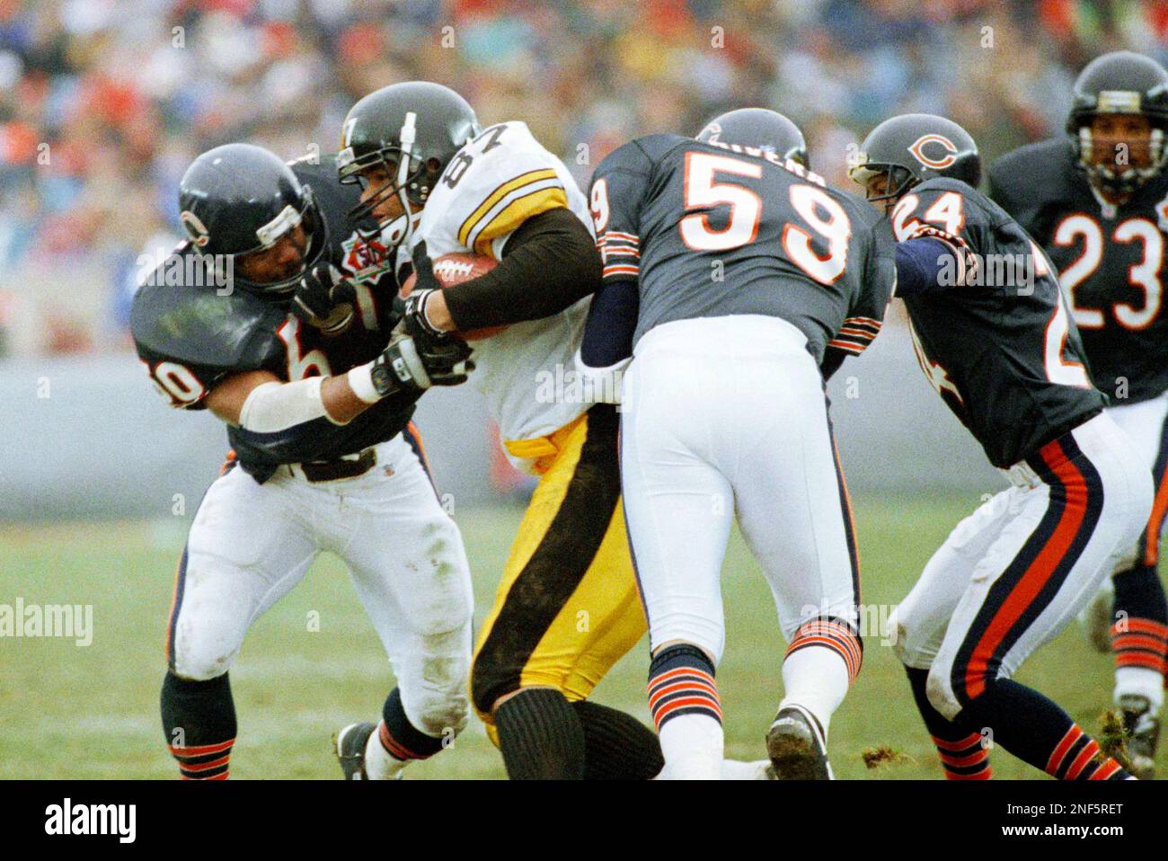 Chicago Bears Mike Singletary tackles Pittsburgh Steelers Adrian Cooper  (87) during the third quarter of their game in Chicago, Dec. 13, 1992. It  was Mike Singletary's last home game for the Chicago