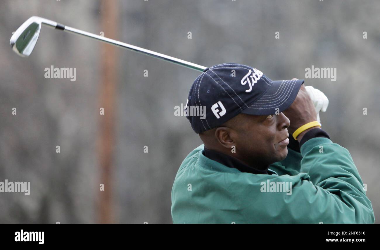 ADVANCE FOR FOR USE FRIDAY, APRIL 3 AND THEREAFTER** Golf teaching pro  Emmanuel Worley hits balls at a driving range Tuesday, March 31, 2009, in  Chicago. Worley came to the game