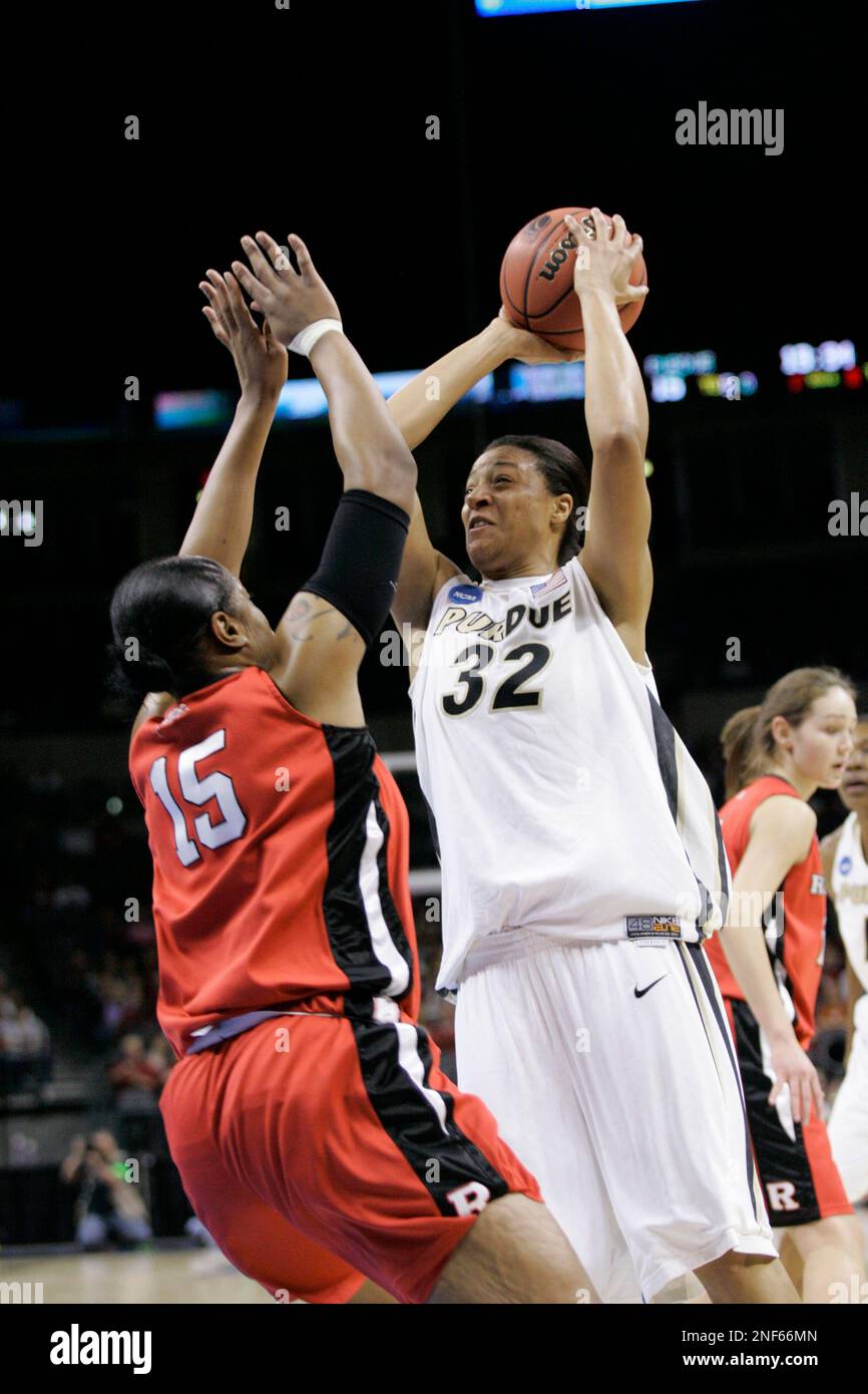 Purdue's Lindsay WisdomHylton (32) takes a shot over Rutgers' Kia