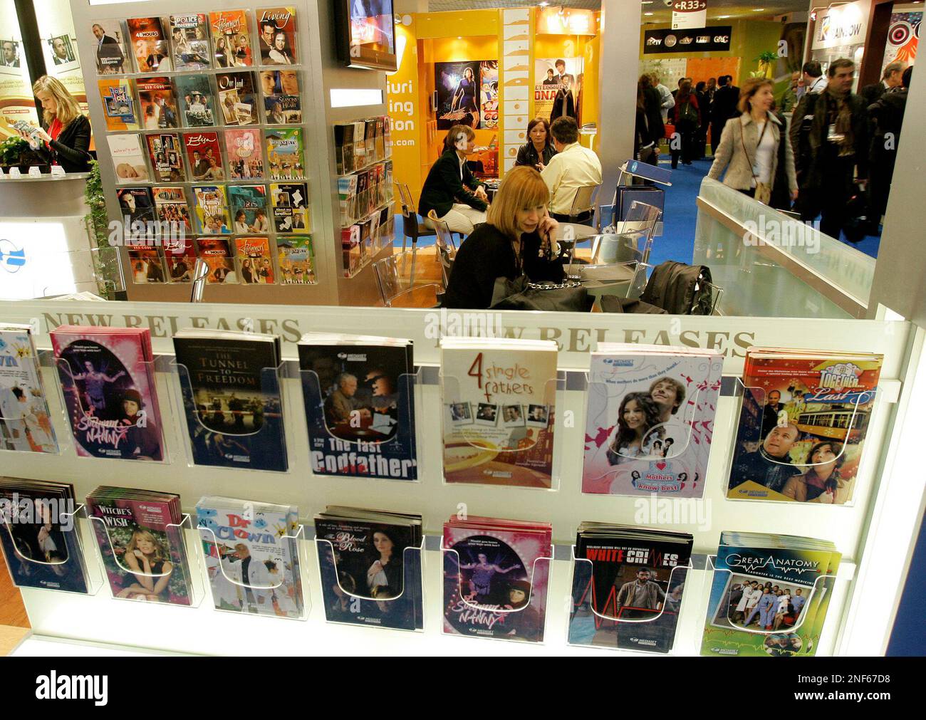 Visitors are seenat a stand at the MIPTV (International Television ...