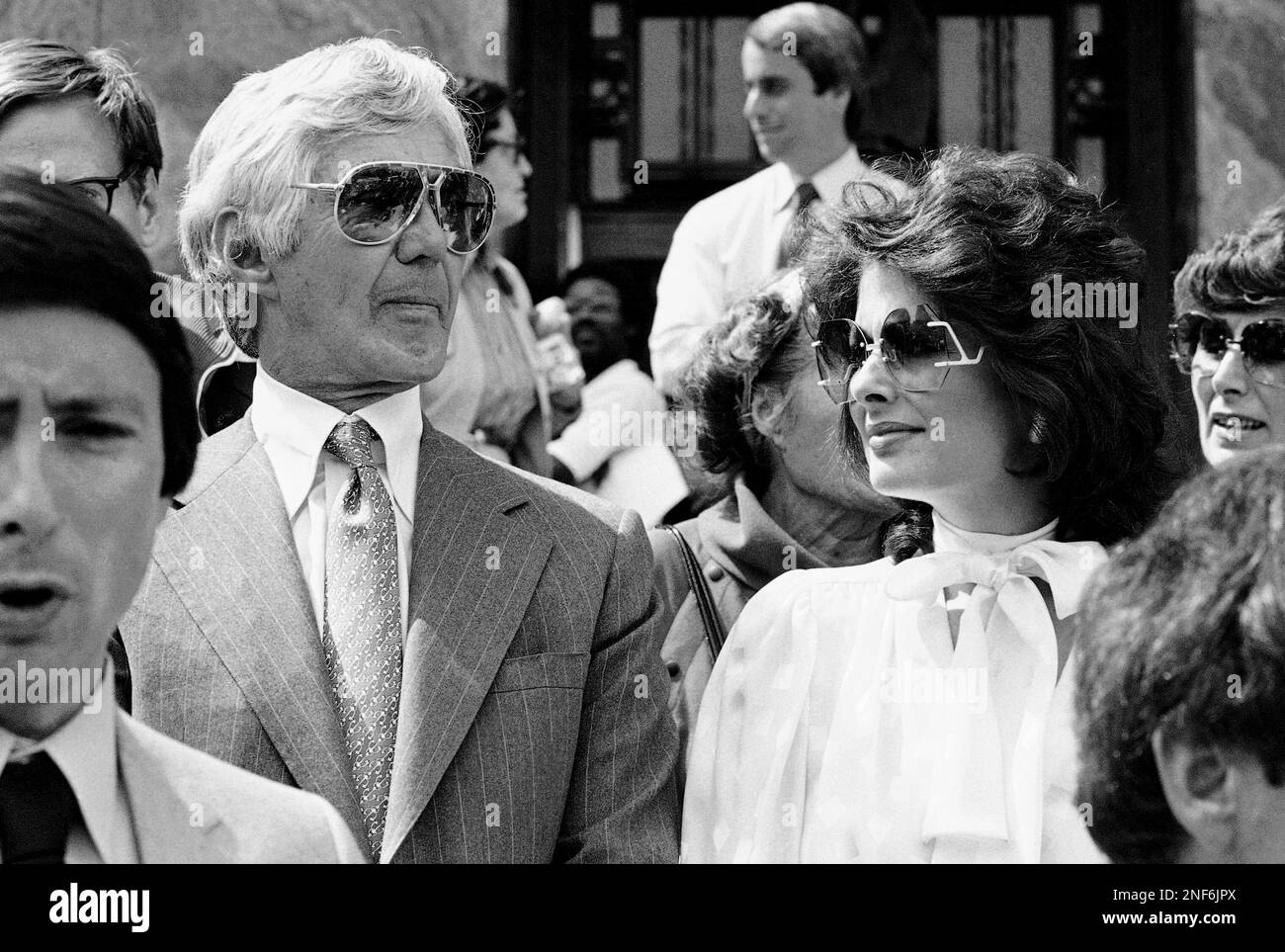 Automaker John DeLorean and his wife, Cristina Ferrare, leave Federal