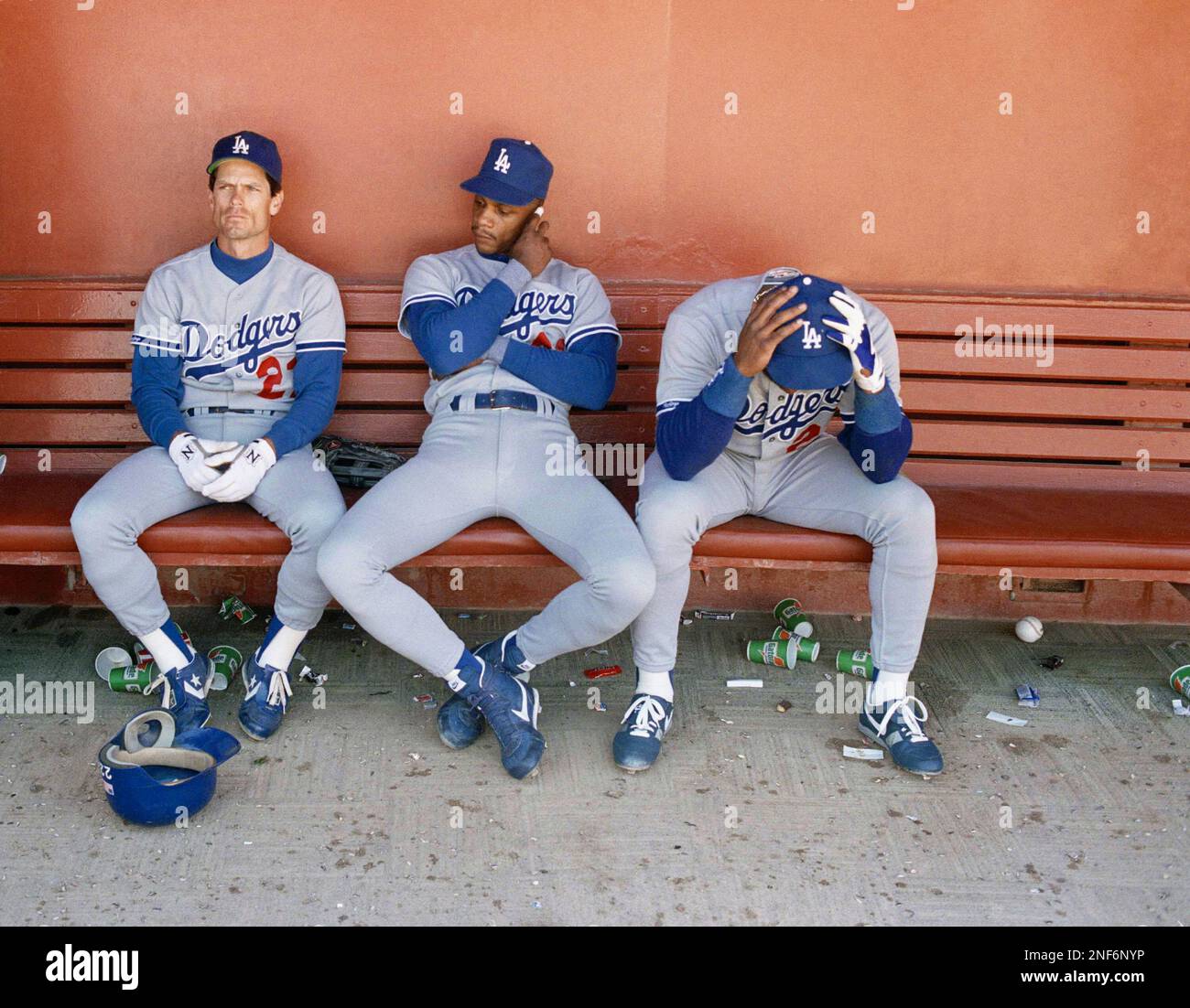 Los Angeles Dodgers players Brett Butler, left, Darryl Strawberry, middle,  and Lenny Harris, right, sit in the dugout after the final out as the San  Francisco Giants beat them 4-1 at Candlestick