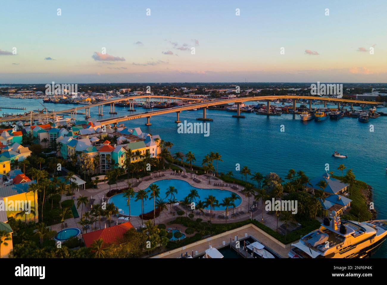 Harborside Villas at sunset aerial view and Paradise Island Bridge at Nassau Harbour, from Paradise Island, Bahamas. Stock Photo