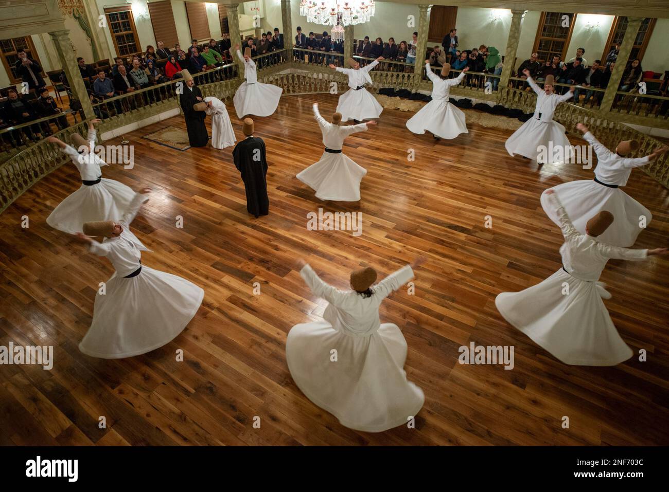 A group performing the Whirling Dervish Show dance to glorify God and seek spiritual perfection Stock Photo