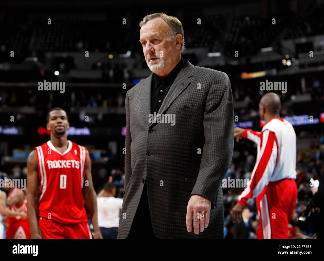 Houston Rockets head coach Rick Adelman heads off the court after