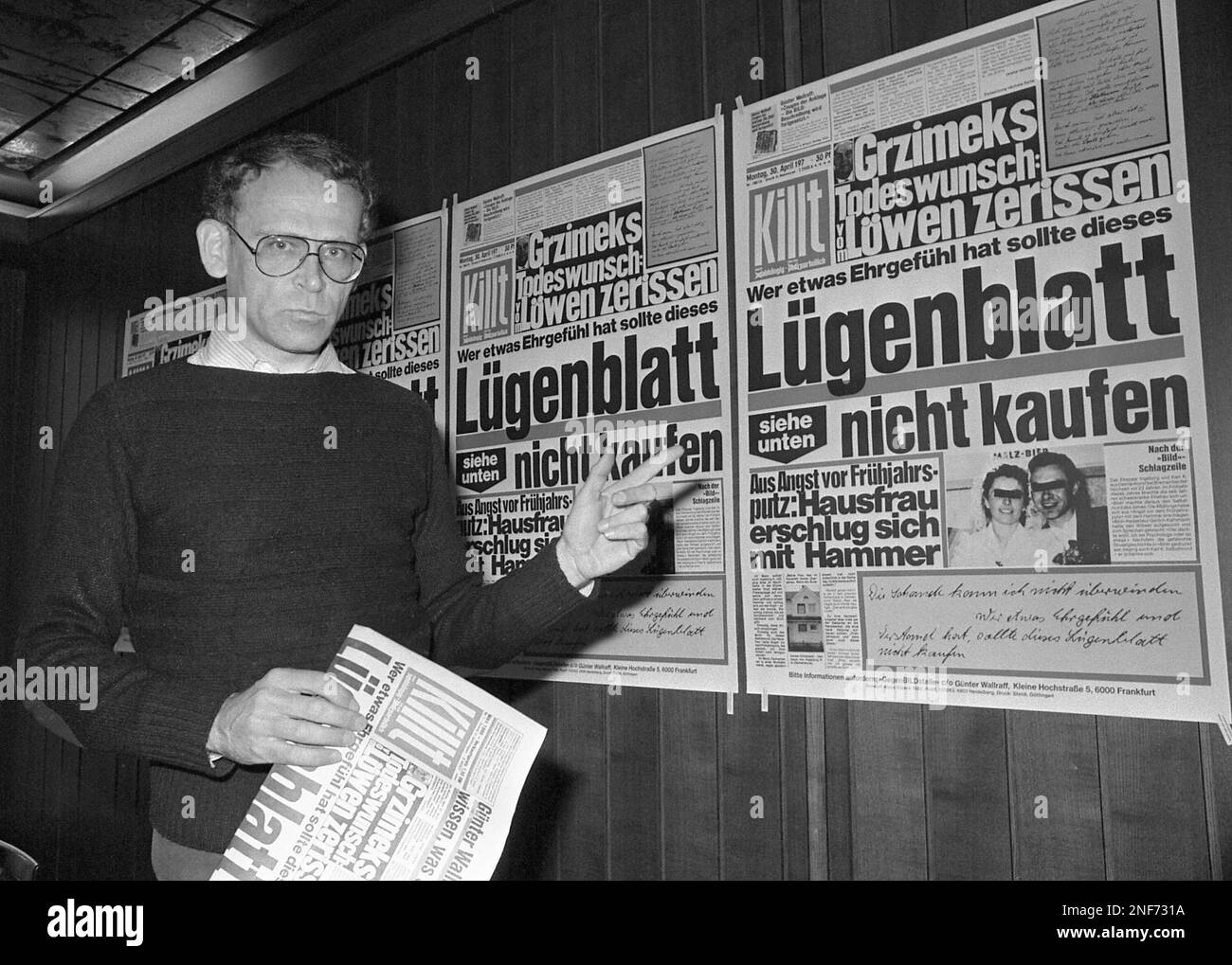 Guenter Wallraff, West German writer, based in Cologne, presents his first copy of his